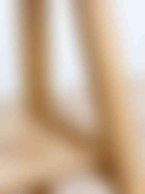 a close up of a solid oak bench with a white background