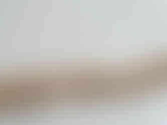 a wooden coat hook against a white wall