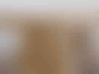 a close up of a waney edge wooden table leg with a white background