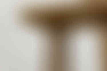 a close up of a wooden table with a white background