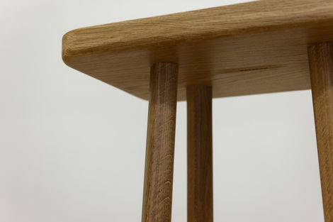 a close up of a wooden table with a white background