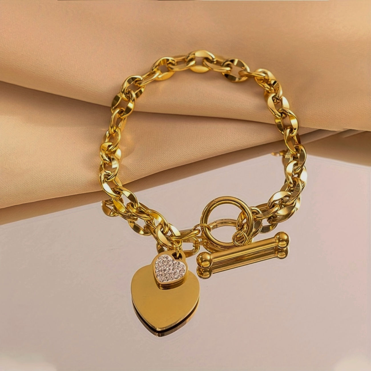 Tender | schakel armbandje met hart bedel goud