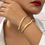 Thumbnail: statement armband goud van world's finest modelfoto