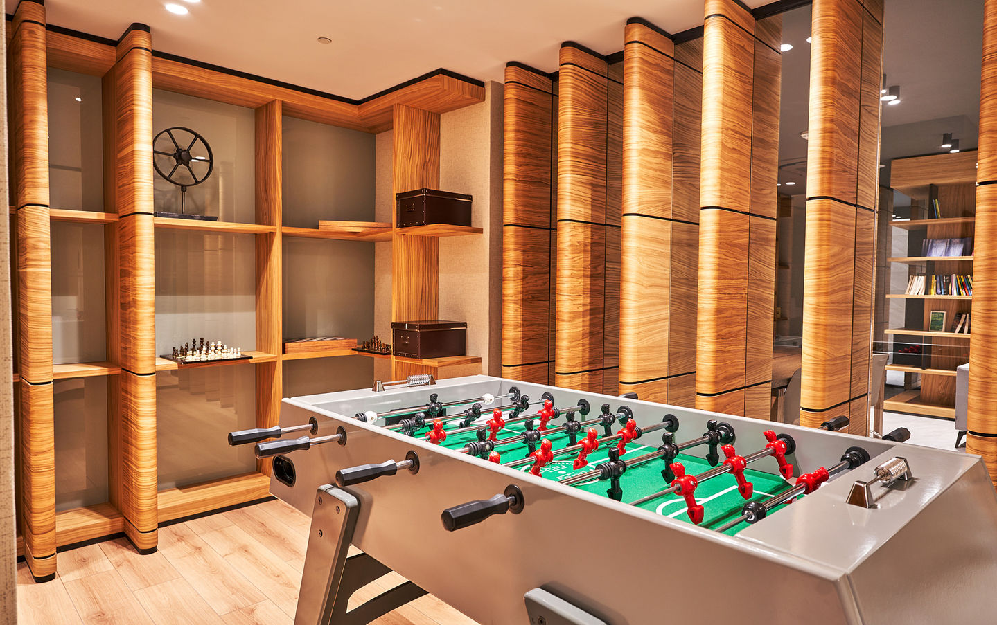 a foosball table in a room with wooden walls