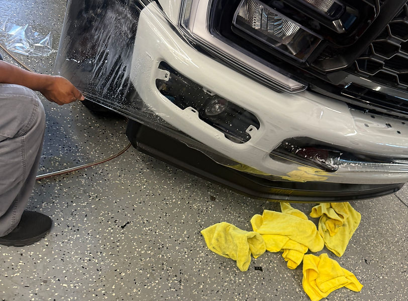 alt="Professional PPF Clear Bra installation on a front bumper at Lucaz Window Tinting in San Jose, California using premium clear shield for cars paint protection film"