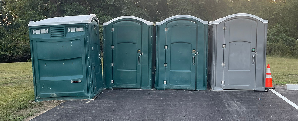 Portable toilet units lined up in a clean outdoor setup, provided by ASAP Waste Services for construction sites, events, and commercial projects across Maryland, DC, and Virginia.

