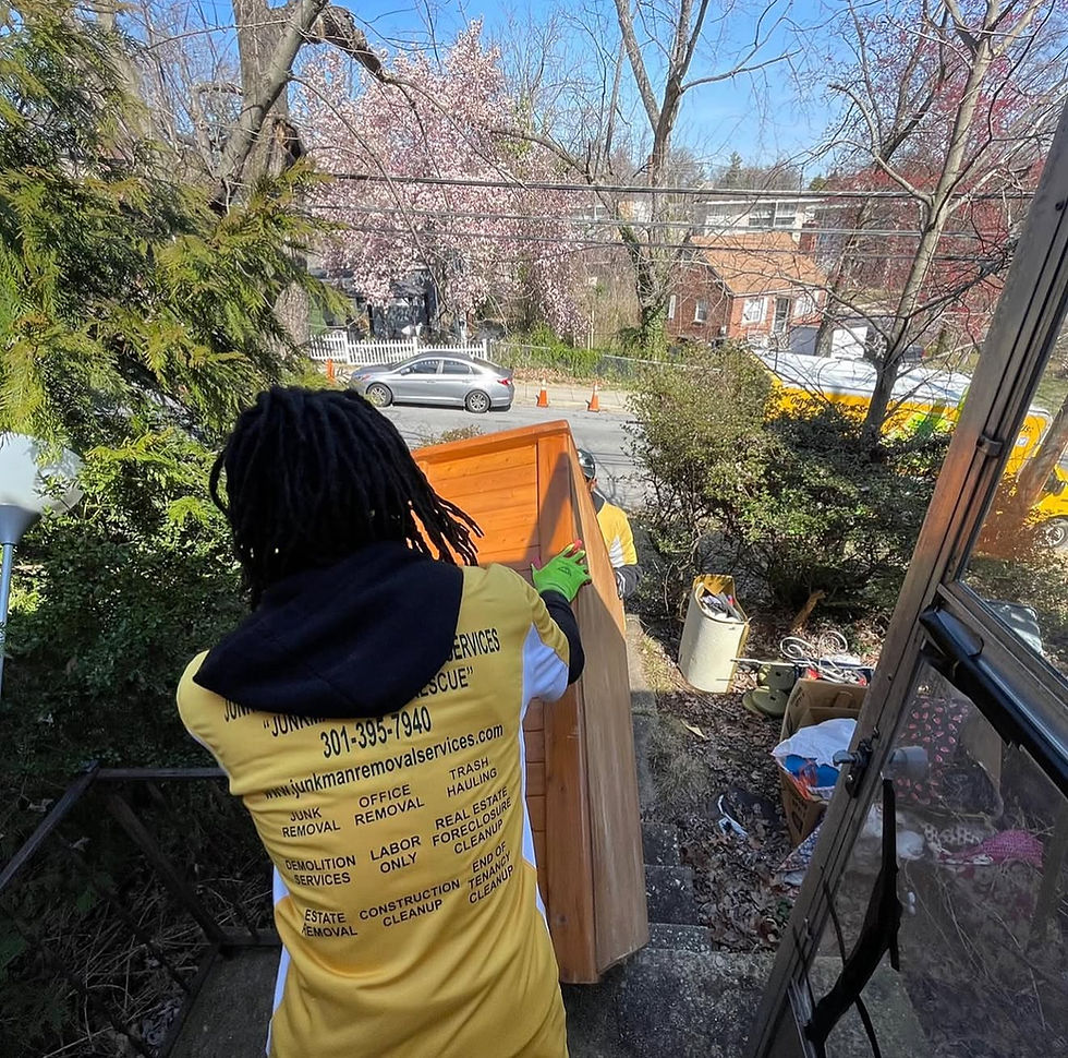Junkman crew removing furniture and household items during a residential property cleanout in Maryland