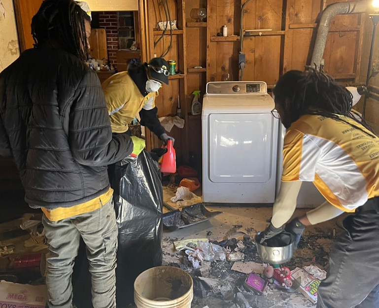 Junkman Removal & Disposal Services crew performing a deep basement cleanout as part of a full whole house cleanout, removing debris and household junk