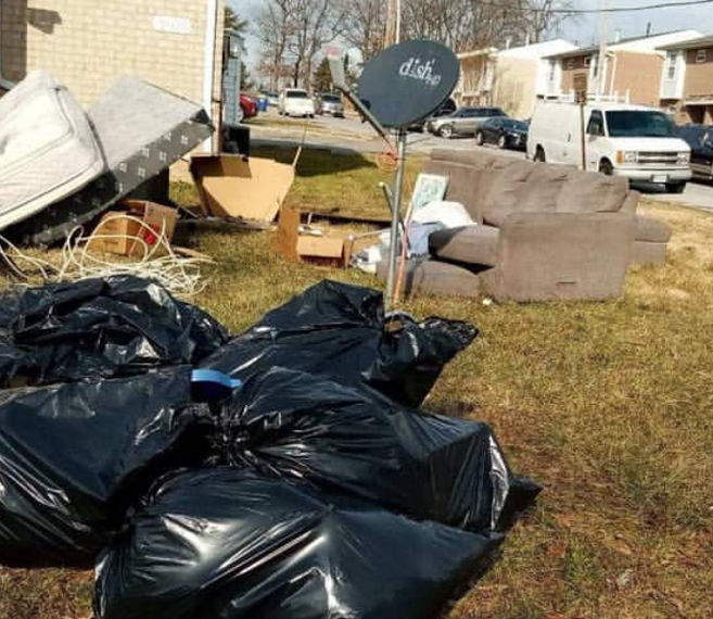 Junk removal at Brandywine HOA — ASAP crew loading furniture and debris curbside for bulk trash day.