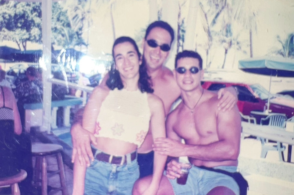 Woman and two men posing for a picture. Vintage.