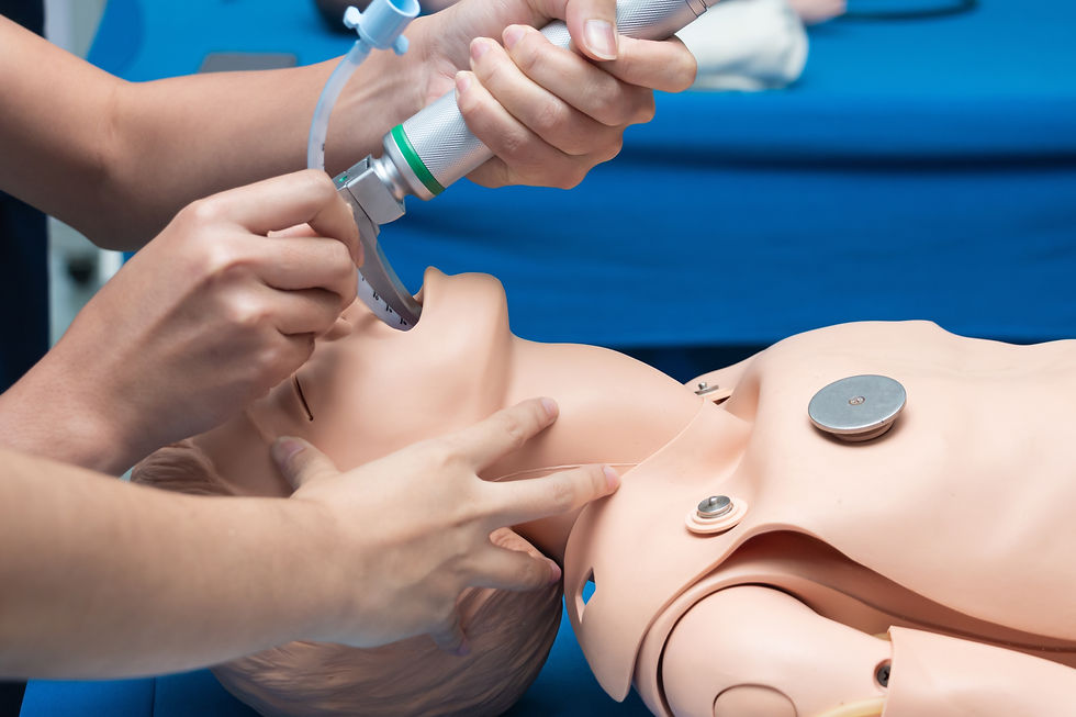 Anesthesiologist performing an orotracheal intubation on a simulation, mannequin dummy dur