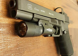 firearm laying on a wooden looking table