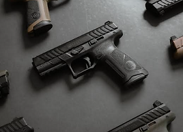 black background with several firearms laid out