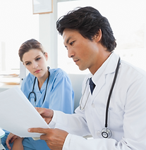 Medical coder going over documents.