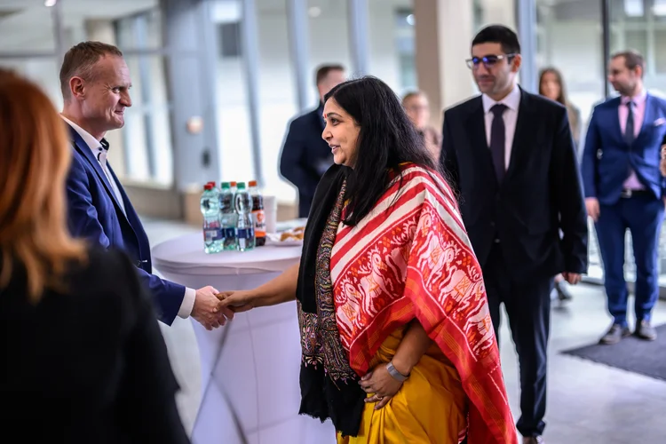 Martin Jančo shakes hands with a foreign visitor