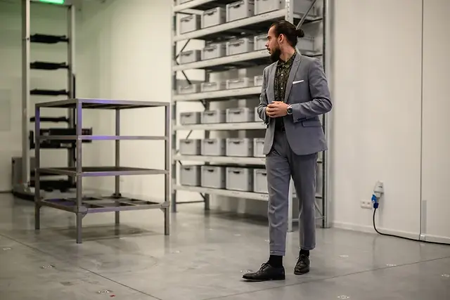 Matej Hliva presents a DEMO in the showroom to foreign visitors.
