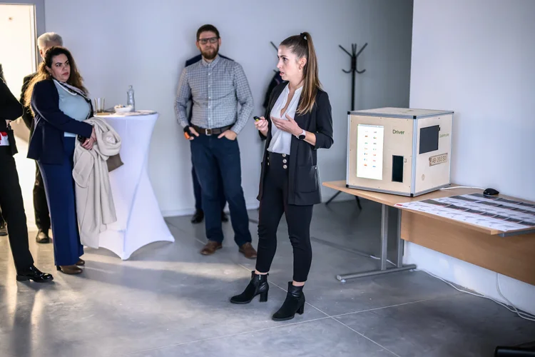 The product manager presents the TLS cube.