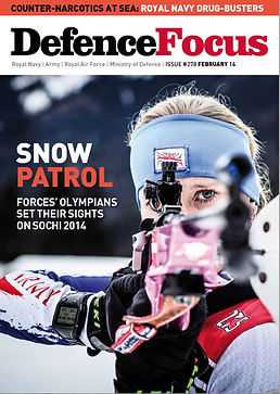 Winter Biathlete Amanda Lightfoot Winter Olympic report, picture of her holding her rifle