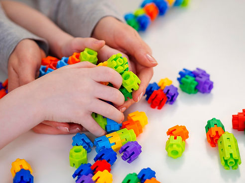 little-boy-playing-with-colorful-game.jpg
