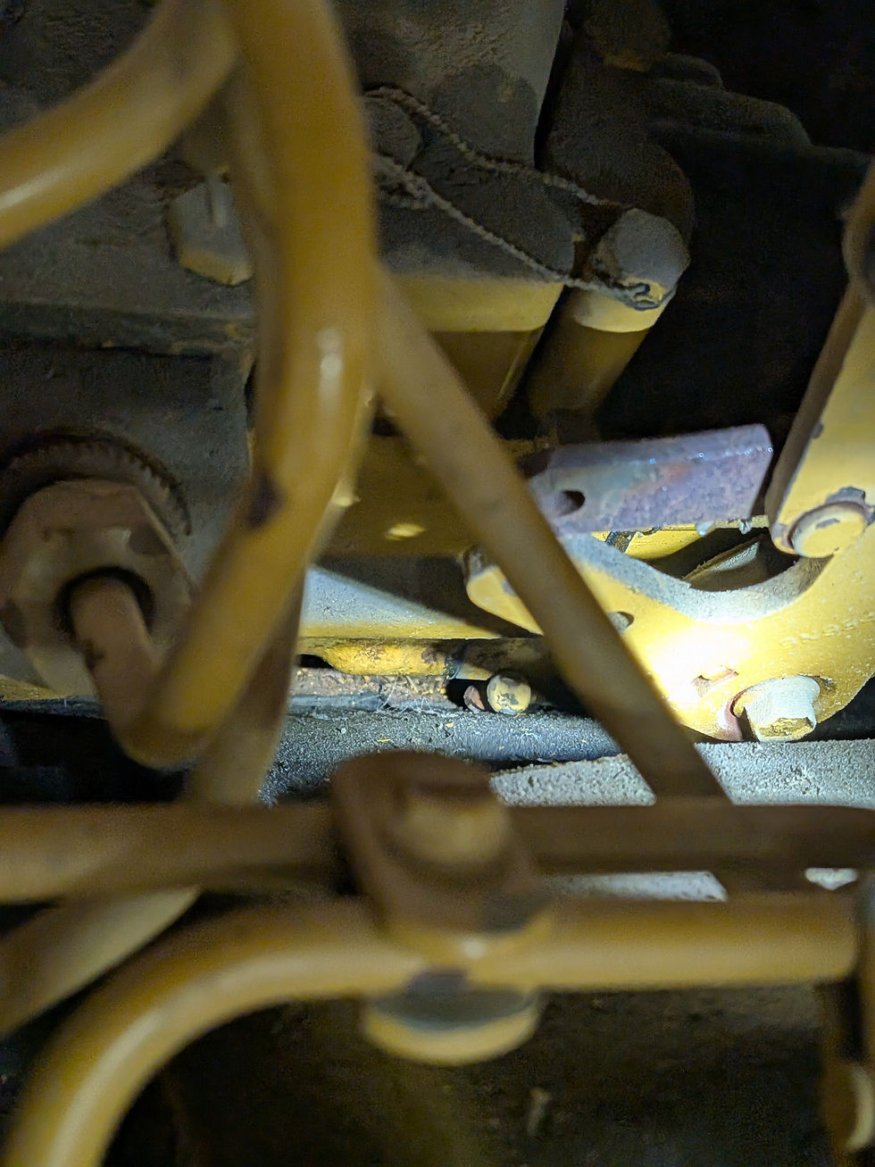 The offending pin can be seen down in the valley off the block and injector pump.