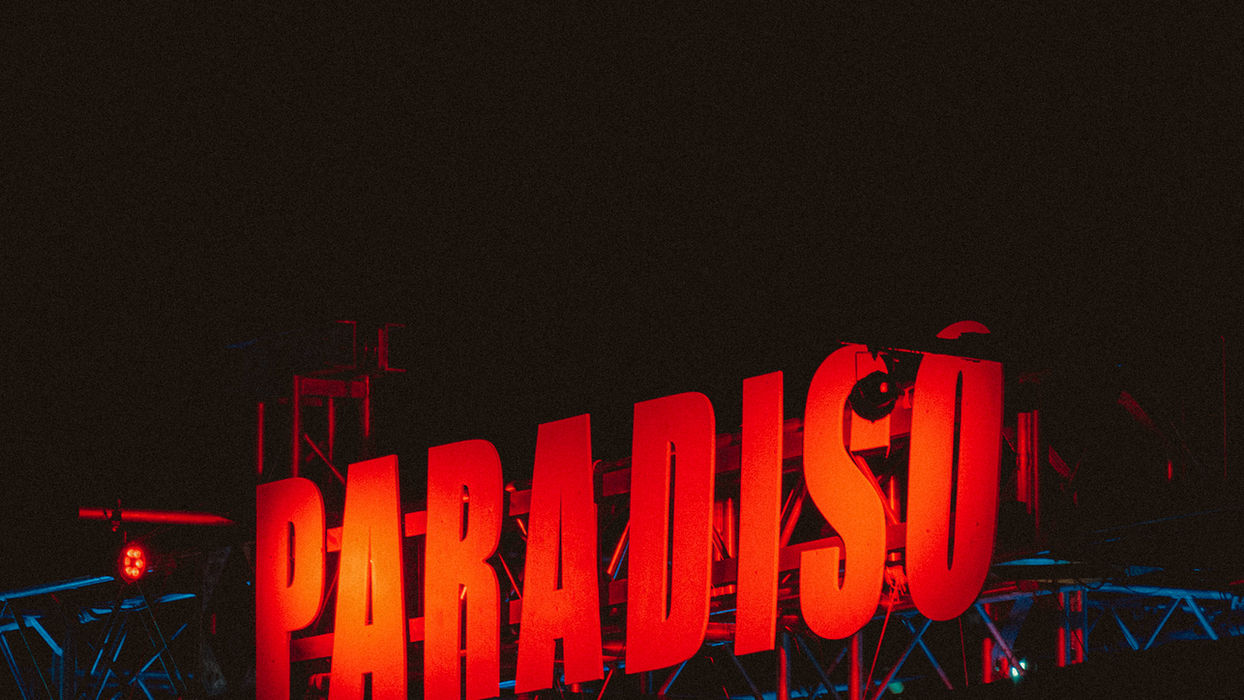 Paradiso stage sign at night, red against the black sky.