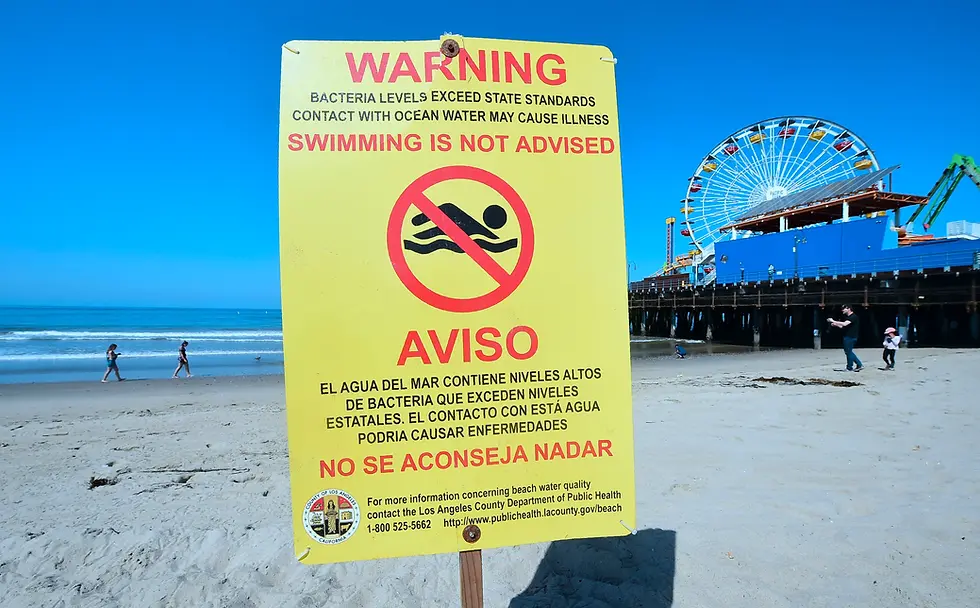 Sign on California Beach Warning People About Dangerous Bacteria Level In Water