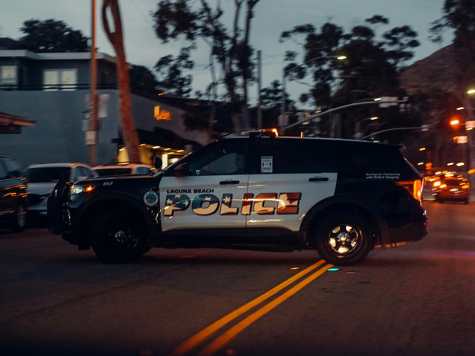 Image of Police Car Parked Horizontally on the Road