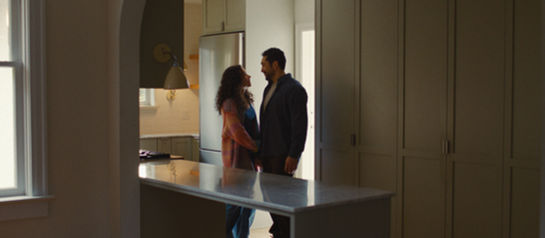 Man And Women Looking At Each Other In Newly Purchased Home