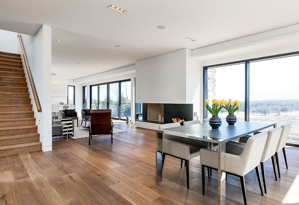Eye-level view of a hardwood floor with natural light streaming in