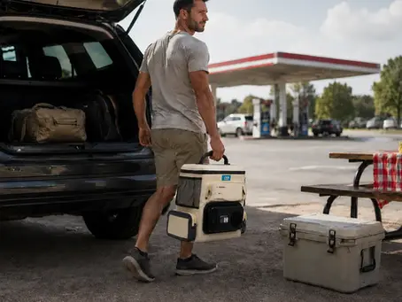 YETI alternatives for road trips without heavy ice, showing a hard cooler and electric cooler backpack near a picnic stop