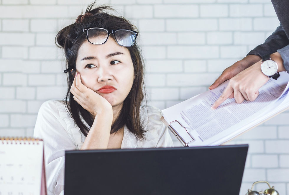 Asian woman not motivated at work (Quiet Quitting)