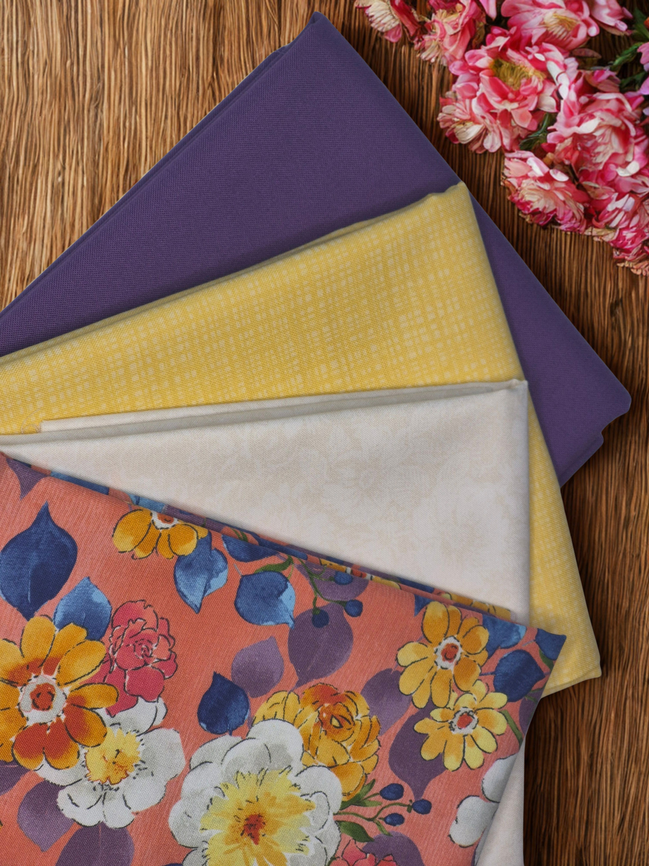 Golden Hour Garden beginner friendly quilt fabric bundle with floral quilting cotton fabrics in pink, yellow, cream, and purp