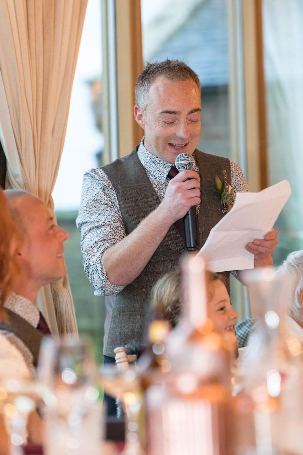 Wedding photograph of the best man during his speech