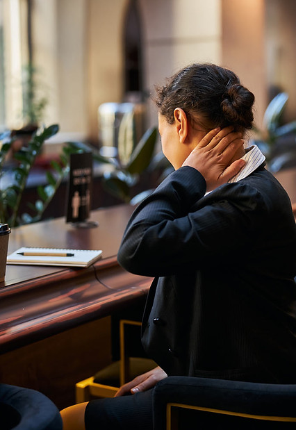 Stressed out female lawyer in need of therapy for BigLaw burnout in NYC