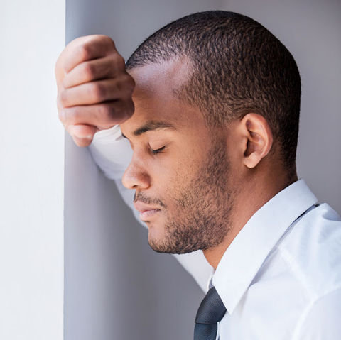 Worried man feeling imposter syndrome