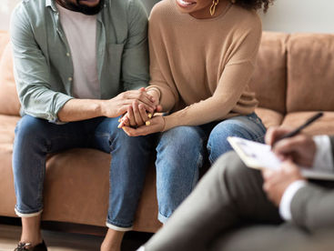 Couple holding hands reconnecting their relationship in therapy in Milwaukee, WI