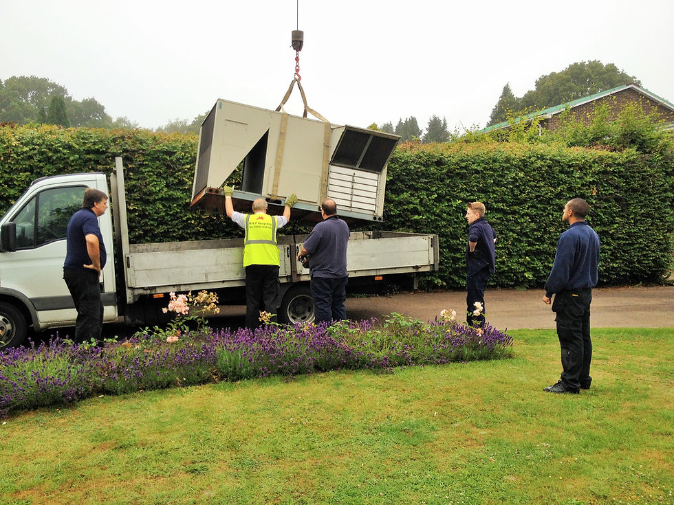Unit being loaded on vehicle for transporting to M & P Recycling.