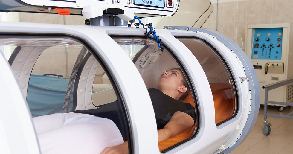 A woman lying inside a hyperbaric chamber