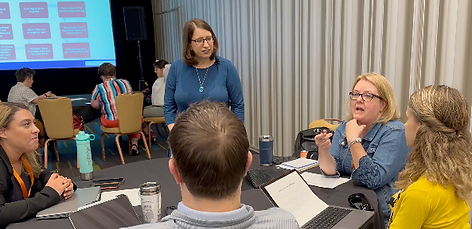 Nedra Weinreich interacting with training participants