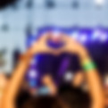 Hands in heart shape at a festival