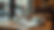 Eye-level view of a cozy coffee shop table with two cups of coffee and a notebook