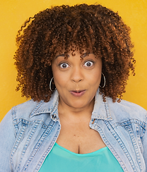 Surprised and wide eyed in teal and denim