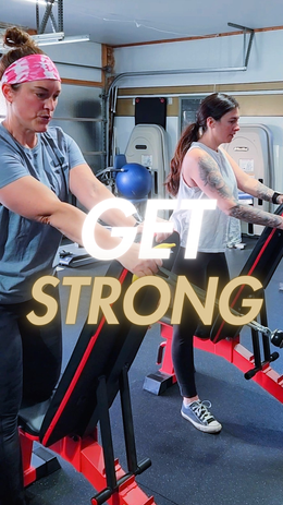 Personal trainer Kenny coaching a small group through a customized strength training circuit in a private studio.
