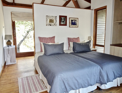 Twin bedroom with en-suite shower at Imani