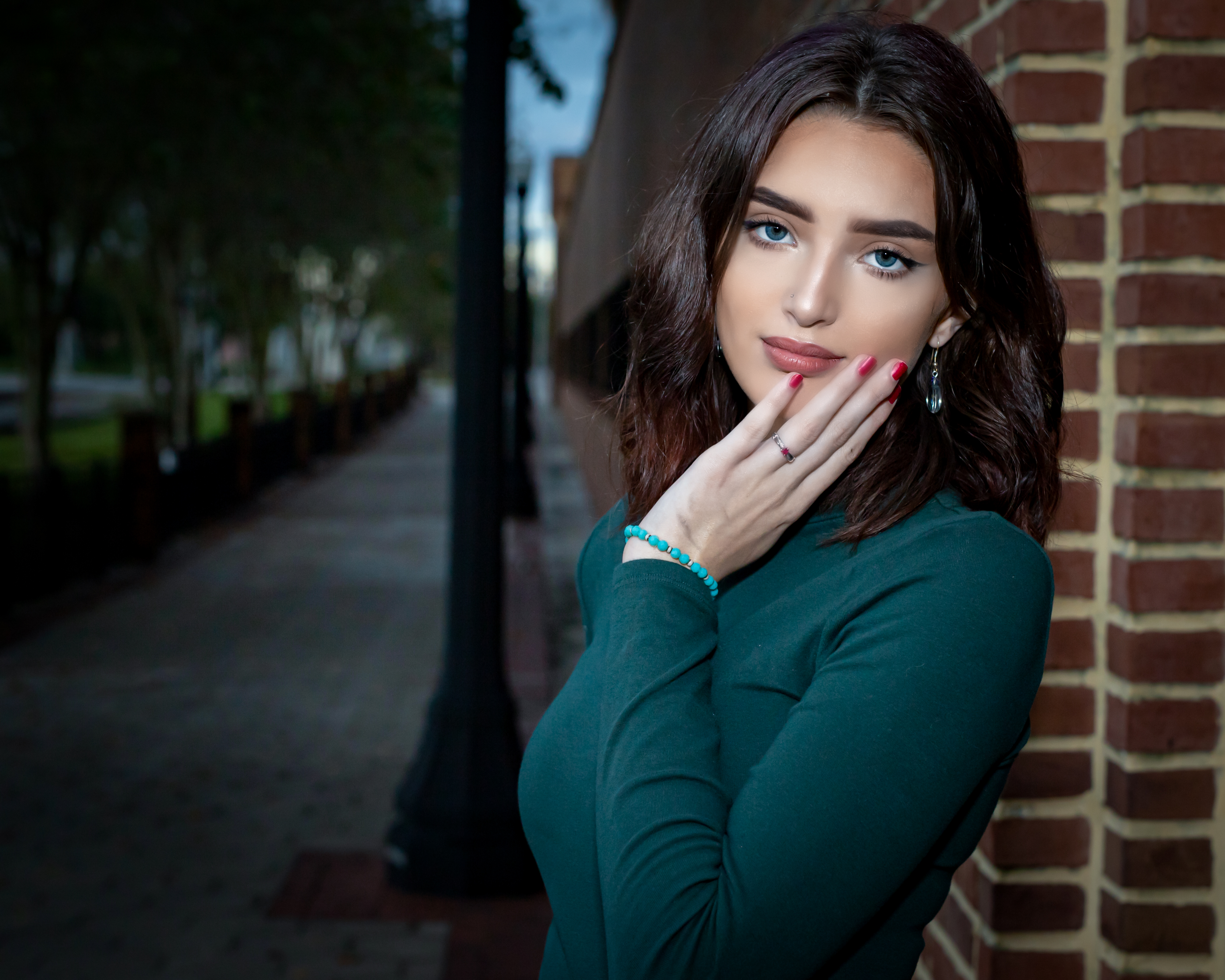 Woman in a green shirt posing