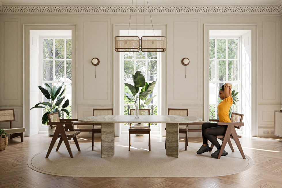 A modern dining area featuring a stone table with a unique V-shaped base, styled with natural tones and greenery, creating a harmonious and serene ambiance.
