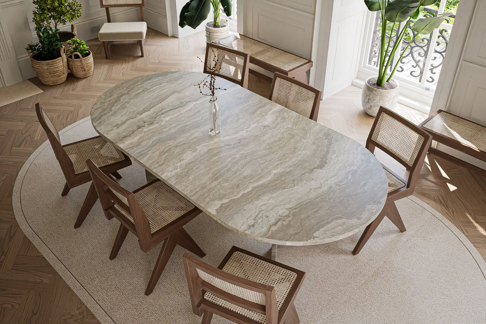 A modern dining area featuring a stone table with a unique V-shaped base, styled with natural tones and greenery, creating a harmonious and serene ambiance.