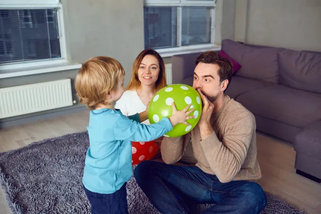 bigstock-A-Happy-Family-With-An-Air-Bal-240474868.jpg.webp