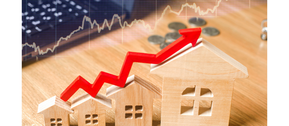 Rising red arrow over wooden houses symbolizing increased home value and real estate investment growth.