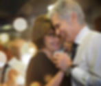 Happy and healthy elderly couple slow dancing.
